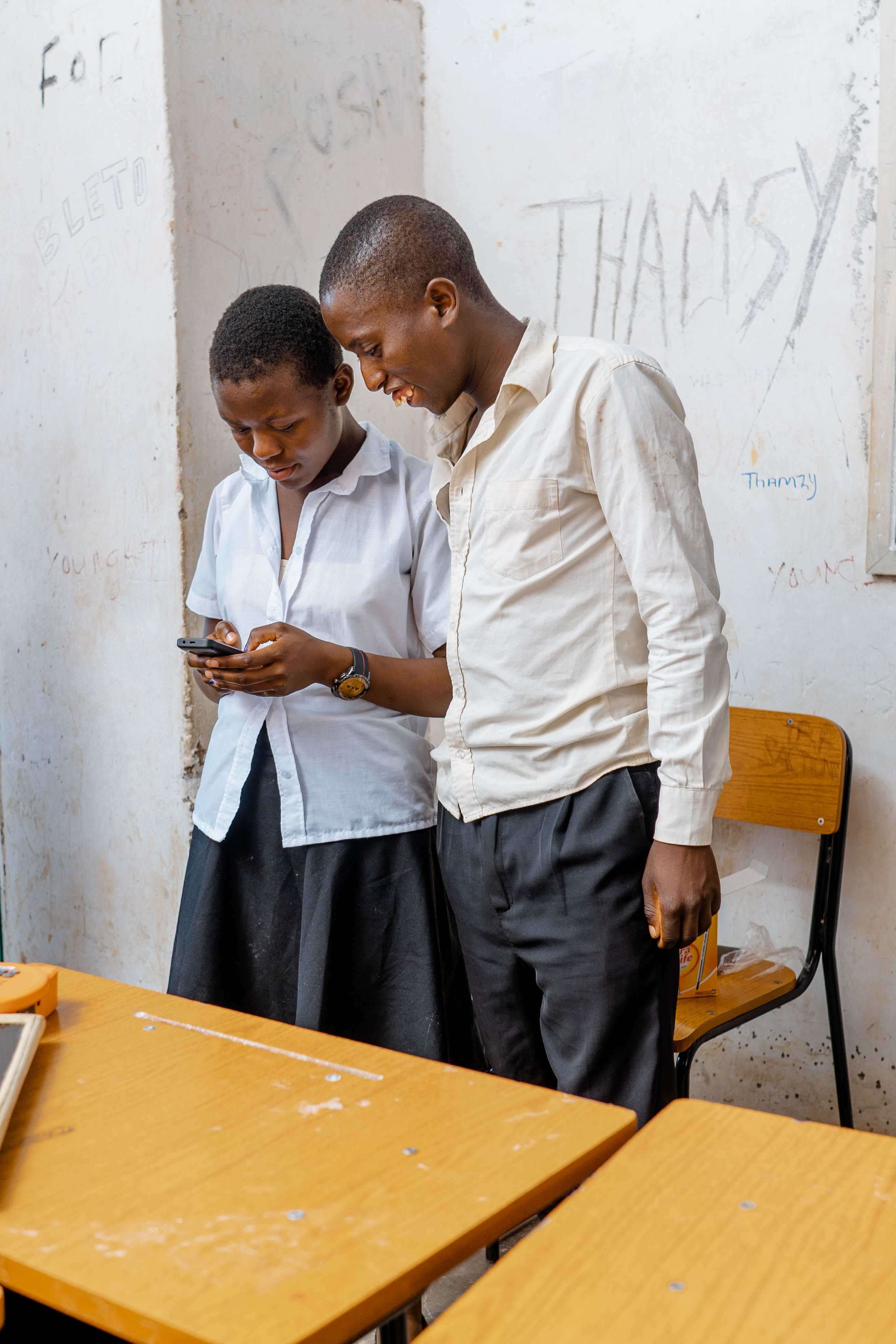 Students using a mobile phone for digital learning