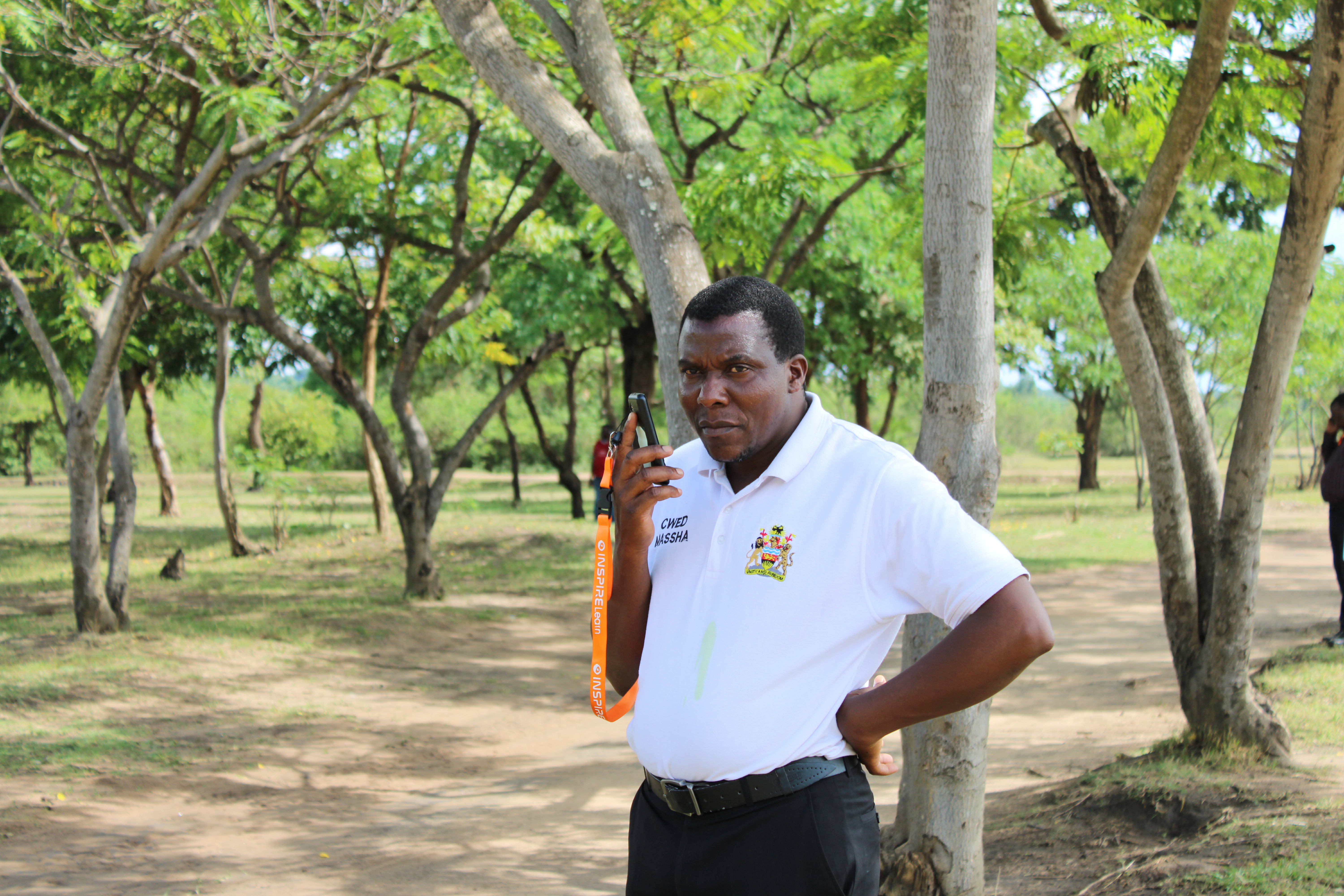 School leader holding a phone while discussing digital learning